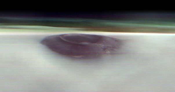 NASA Mars Orbiter catches image of volcano peeking above morning cloud tops
