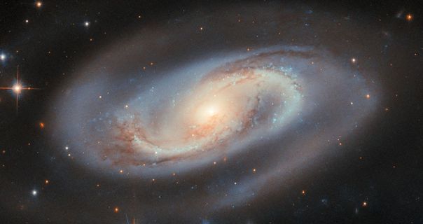 Hubble captures image of far-off spiral galaxy with active supermassive black hole at its core