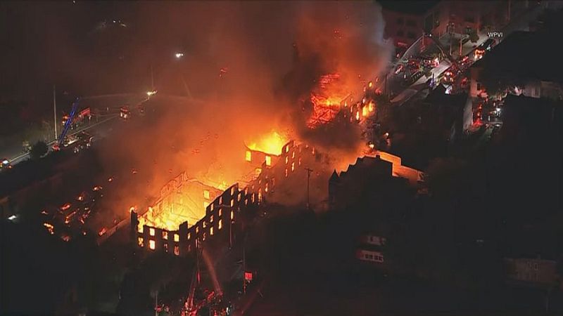 Ace News Today: Massive six-alarm fire tears through Allentown industrial building, damaging homes, forcing evacuations. Image credit: X